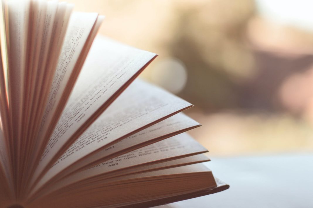 pexels-photo-46274 book opened on white surface selective focus photography