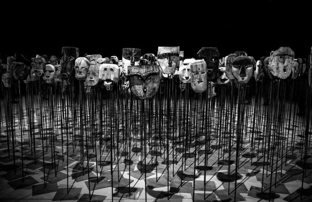 pexels-photo-669319 greyscale photo of masks on a stick